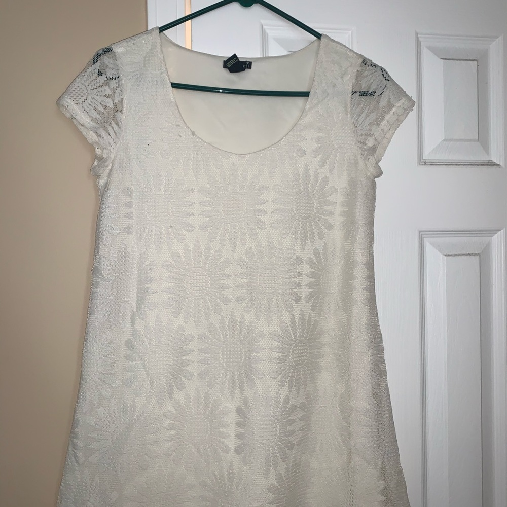 Ivory lace dress with flowers.